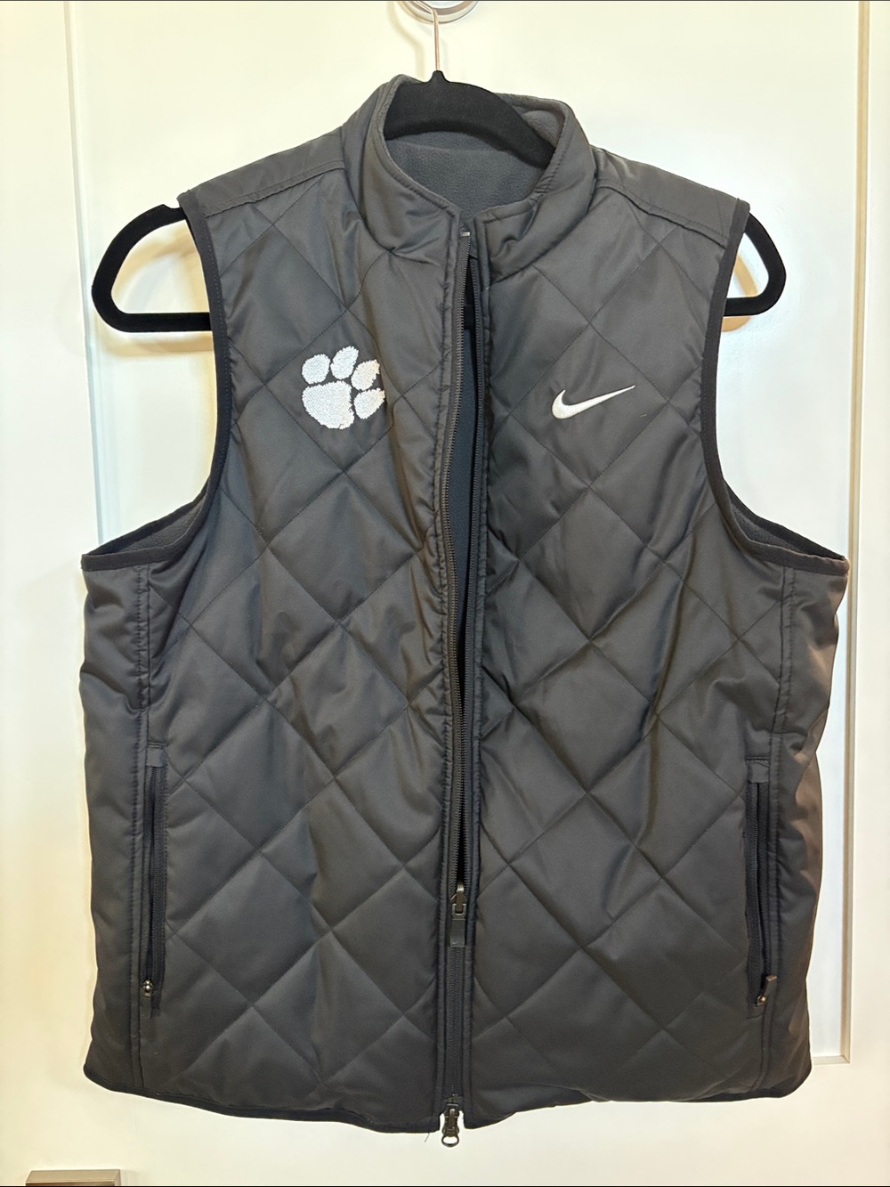 Nike Women’s reversible Quilted/Fleece Black Vest with White Paw and Swoosh